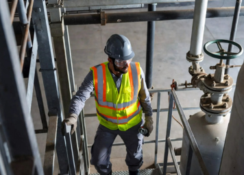 Eagles Crew LLC technician performing preventive plumbing maintenance in a high-rise building in Deira Dubai