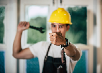 Eagles Crew technician performing building maintenance inspection in Dubai