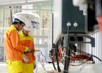 Professional electrician performing electrical wiring installation in a commercial building in Dubai